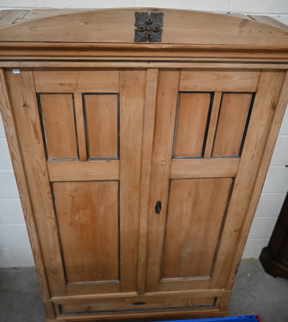 An antique pine knock-down wardrobe with twin panelled doors enclosing open hanging space on - Image 2 of 4