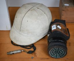 A vintage Waddington's 'Topper' motorcyclist's crash-helmet to/w a gas-mask and a whistle dated 1916