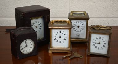 Five various carriage/travel clocks - two with leather cases