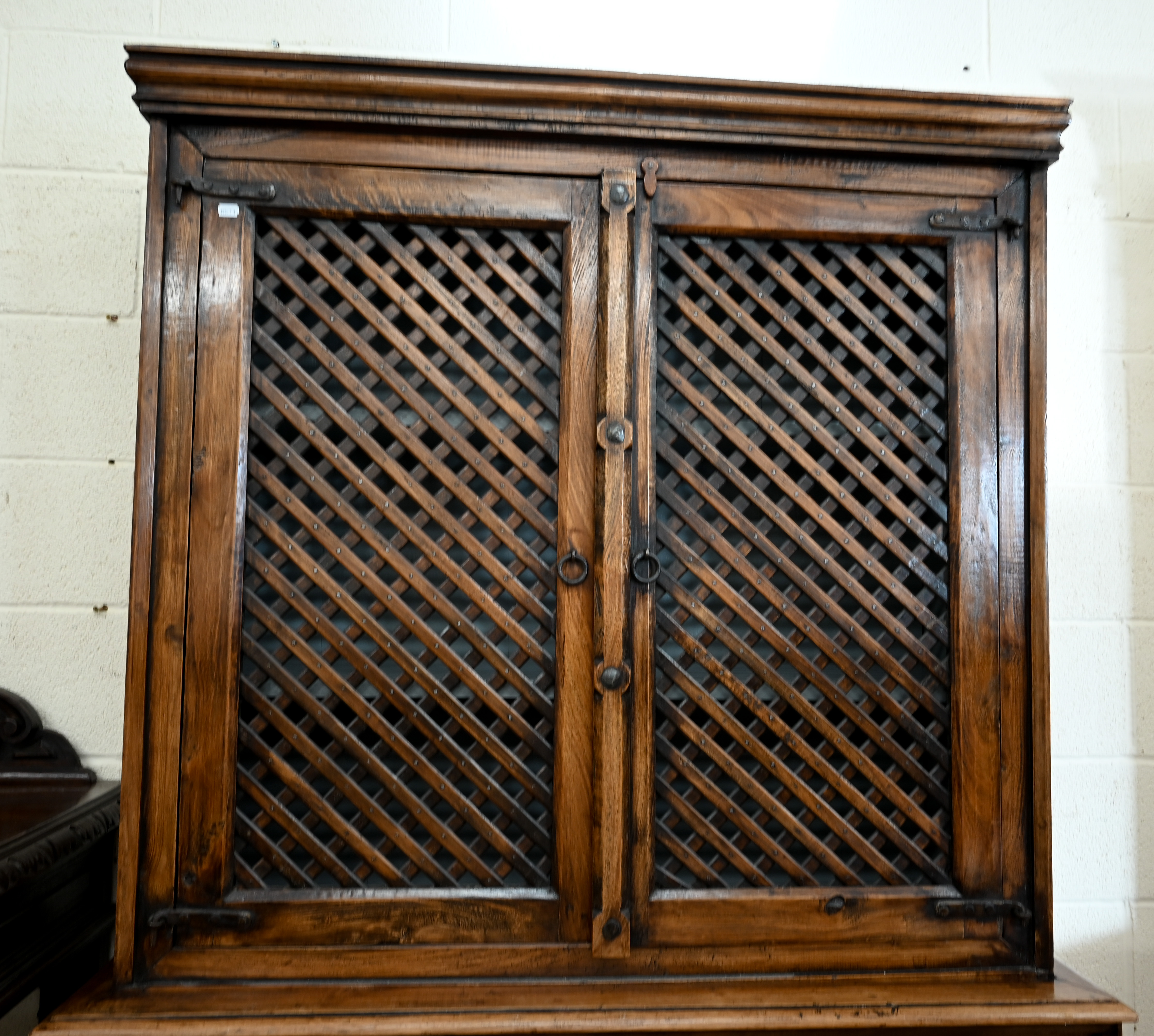 An Indian hardwood two part cabinet with open lattice panelled doors on base with two drawers and - Image 2 of 6