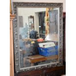 A large modern rectangular mirror in decorative silvered floral and foliate design frame, 150 x