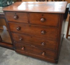 A Victorian chest of two short over three long drawers with turned handles and bun feet, 98 cm