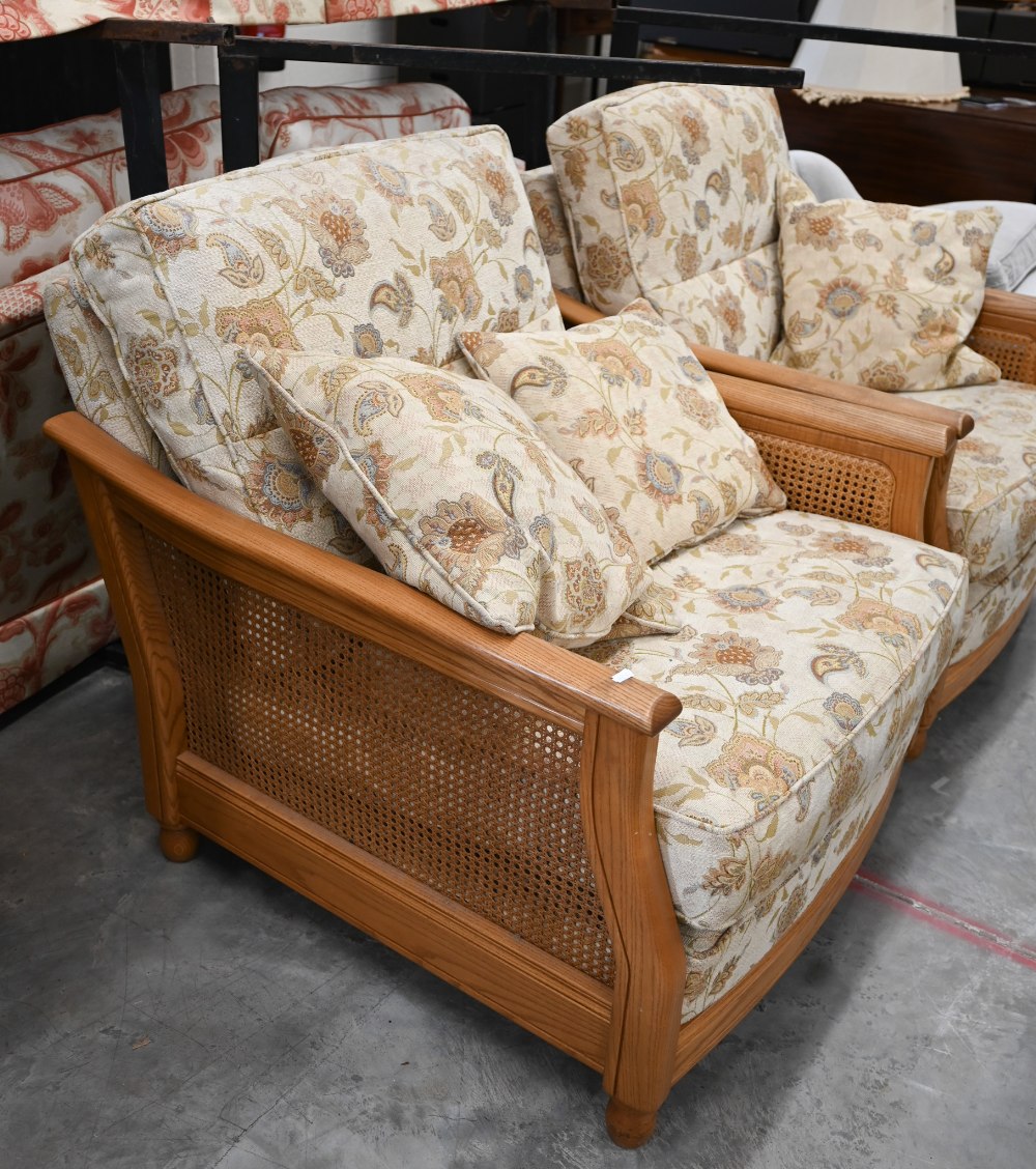 An Ercol ash and woven cane bergere three piece suite, two seater sofa and pair of armchairs, - Image 3 of 6