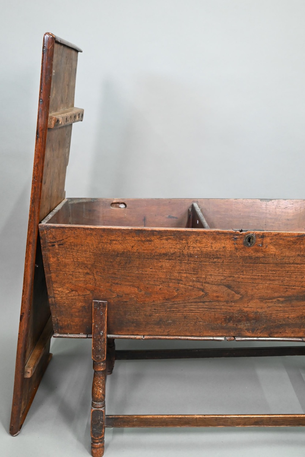 An antique oak dough bin, oak and walnut, the tapered body with single plank top, raised on part - Image 4 of 7