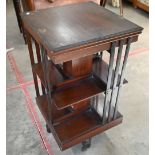 Edwardian mahogany square revolving bookcase on cruciform base with casters, 45 x 45 x 84 cm high
