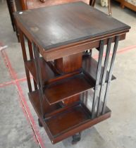 Edwardian mahogany square revolving bookcase on cruciform base with casters, 45 x 45 x 84 cm high
