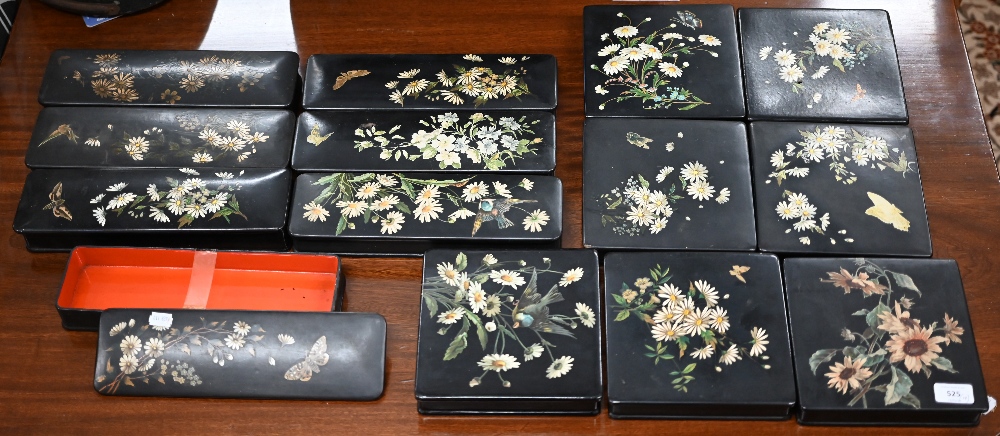 Seven Continental black-laquered and papier mache trinket boxes, with floral printed and painted