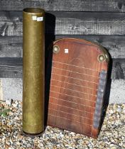 A vintage shove ha'penny board with copper mounts to/w a cylindrical brass stick stand (2)
