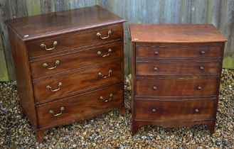 A Victorian mahogany bow-fronted commode, the hinged top with double dummy drawer front enclosing