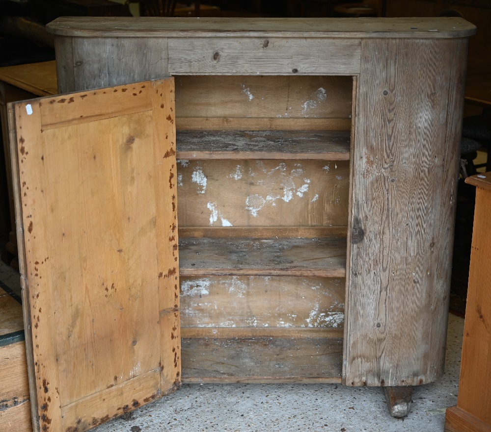 An antique French stripped pine cupboard, with rounded ends centred by a single door, raised on - Image 3 of 3