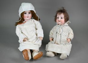 An Armand Marseille 990 A5M bisque-headed baby doll with cropped brown wig, closing blue eyes and