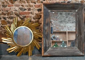 A rectangular mirror in rustic stained pine frame, 101 x 81 cm to/w gilt 'palm frond' design mirror,