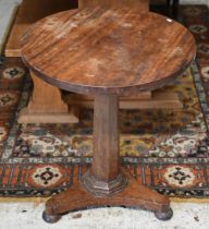 A Regency mahogany occasional table, the circular top raised on a multi-facetted pillar on a tri-