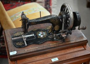 An antique C & K Improved Singer System sewing machine