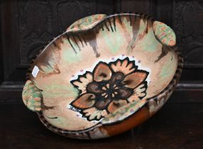A Paul Fouillen (Quimper) design studio pottery bowl with floral motif and streaked and marbled