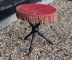 Late 19th/early 20th century circular gypsy table with tooled fabric covered top and ebonised frame,