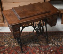 A Jones treadle sewing machine, appears complete and original/unrestored