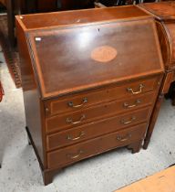 A Sheraton Revival cross-banded and inlaid satinwood bureau, with fitted interior over four long