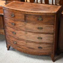 A Victorian cross-banded mahogany chest of two short over three long graduated drawers, raised on