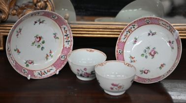 A pair of 19th century Chinese famille-rose saucers and a pair of (non-matching) floral-painted
