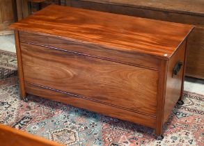 A mid-century hardwood blanket chest, with carrying handles to the sides, on castors, 121.5 cm x