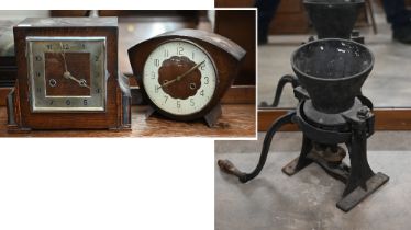 A vintage cast iron large coffee/spice-grinder to/w two oak twin-train mantel clocks (3)