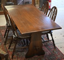 An Ercol style elm dining table and four side chairs, 160 cm x 77 cm x 74 cm (5)