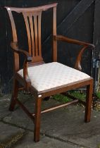 A George III mahogany open armchair, with floral pattern seat, reduced in height/alterations