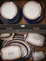 A late Victorian Royal Worcester dinner service with painted sepia Gothic Revival borders and blue