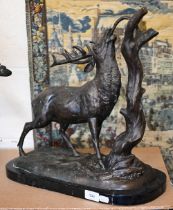A bronzed stag eating from a branch, 45 cm high