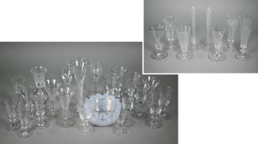 A pair of 19th century slender glass flute glasses with foliate etched decoration and ground-out