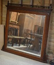 A large late 19th century oak over-mantel, with bevel edged mirror, a/f, 183 cm x 49 cm x 82 cm h