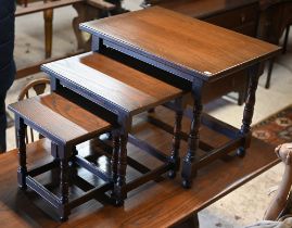 A modern nest of three graduated elm occasional tables, the largest 68 cm x 47 cm x 51 cm h