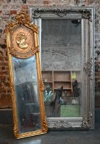 A French Louis XV style gilt framed mirror, 50 x 170 cm to/w a Baroque style mirror in silvered