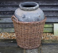 A large fibreglass urn or olive jar in a tight-fitting wicker basket, 78 cm high