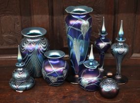 A collection of Okra Art Nouveau style iridescent glass including five scent bottles and stoppers