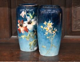 A pair of Montigny-sur-Loing faience vases, painted with flowers on a blue ground, 22.5 cm high (2)