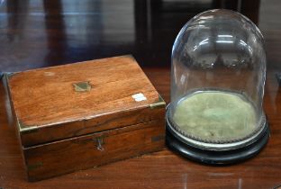 A Victorian brass-bound walnut writing slope, 30 cm wide to/w a glass dome on ebonised plinth (2)