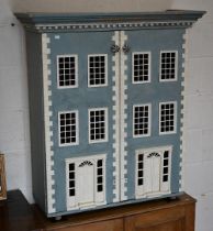 A painted two-door 'doll's house' side cabinet in the form of a Georgian townhouse, 80 cm wide x