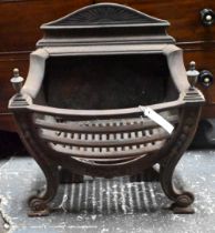 An antique cast iron and brass urn finial Adam style fire basket, with bow front raised on scroll