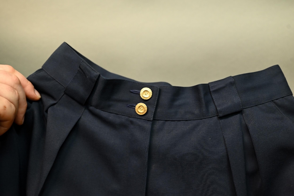 Chanel - A pair of navy trousers, with pleated front and gilt metal button detailing, fully lined, - Image 4 of 6