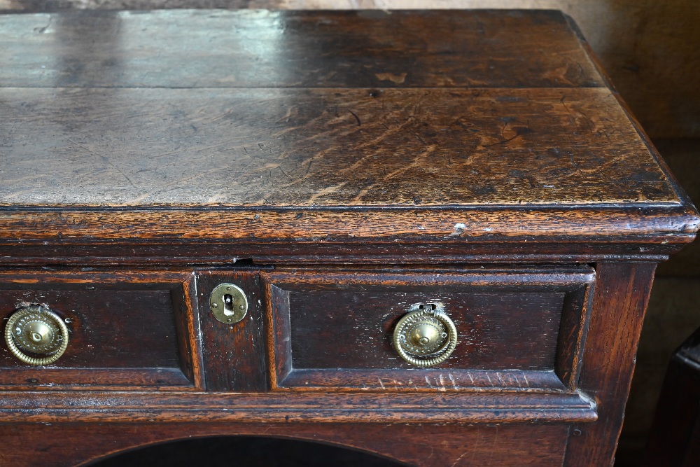 An antique oak low dresser with three double moulded front drawers over a triple arched apron, - Image 11 of 23