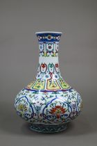 A Chinese doucai pear-shaped vase, painted in underglaze blue and polychrome enamels with