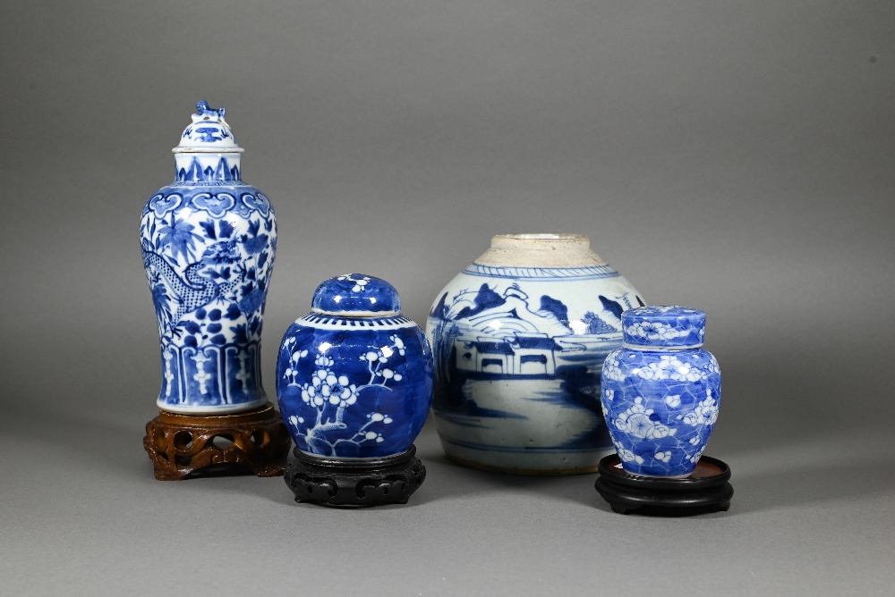 A 19th century Chinese blue and white baluster vase painted with two dragons, Kangxi four-