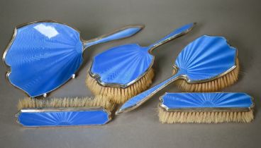 An Art Deco blue guilloche enamel and silver five-piece brush set, Harrods, London 1940 . Mirror and