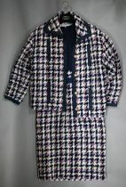 Chanel - A woollen tweed checked jacket and navy and tweed dress, with braided edges and gilt