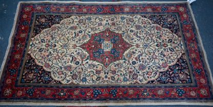 An old North West Persian Sarouk rug, the camel ground with floral garden design, 217 cm x 133 cm