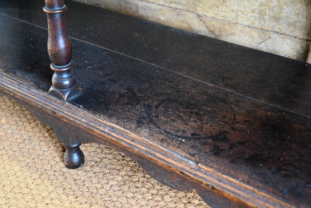 An antique oak low dresser with three double moulded front drawers over a triple arched apron, - Image 8 of 23