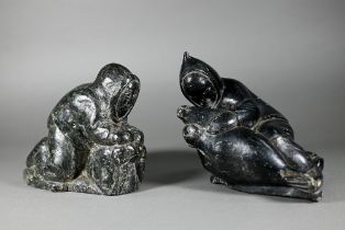 Two Inuit carved basalt groups - huntsmen with walrus and seal, each 16 cm high