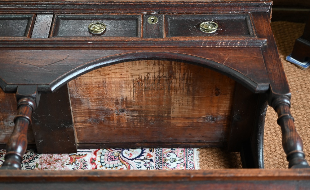 An antique oak low dresser with three double moulded front drawers over a triple arched apron, - Image 15 of 23